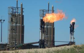 Carbon dioxide emitted from a natural gas flare at a North Dakota oil well