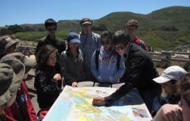 Students looking over a map
