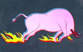 A pink bull standing in fire