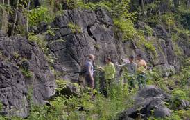 People standing by a cliff