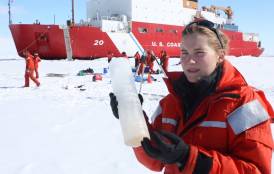 Kate Lowry holding arctic sea ice 