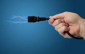 hand holding electric plug