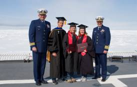 Cost Guard officers, Prof Arrigo, and two graduates on deck.