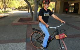 Tom Koos riding a Stanford Earth bike 