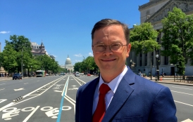 Kai Anderson with Washington, D.C, with Capitol Building in background.